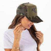 ALOHA COLLECTION TRUCKER HAT / BLACK/CAMO