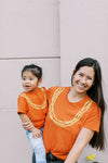 MAHINA MADE KEIKI PAKALANA TEE - RED RUST