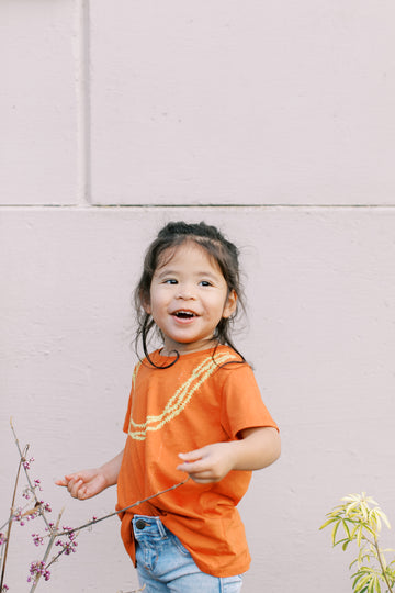 MAHINA MADE KEIKI PAKALANA TEE - RED RUST